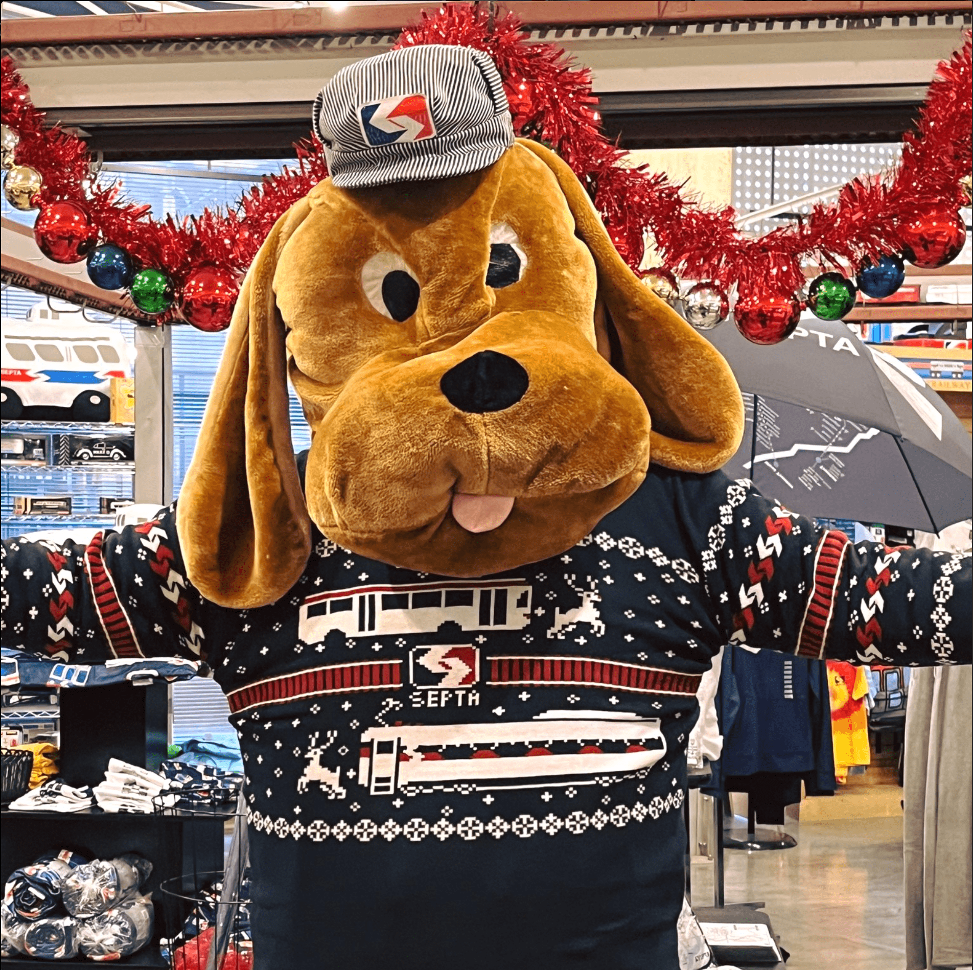 SEPTA's safety mascot wearing the Holiday sweater