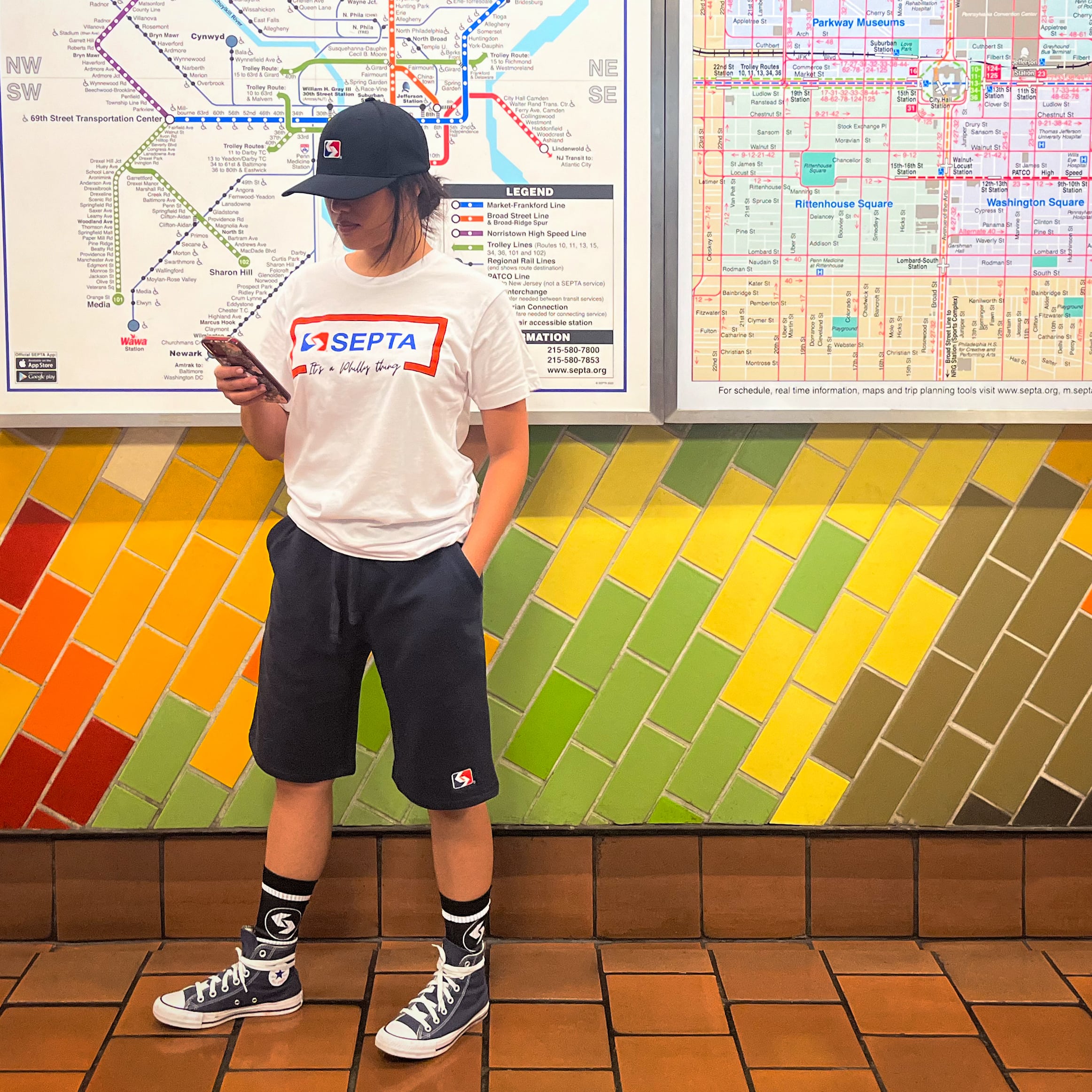 Model with SEPTA Tee, shorts, hat, and socks