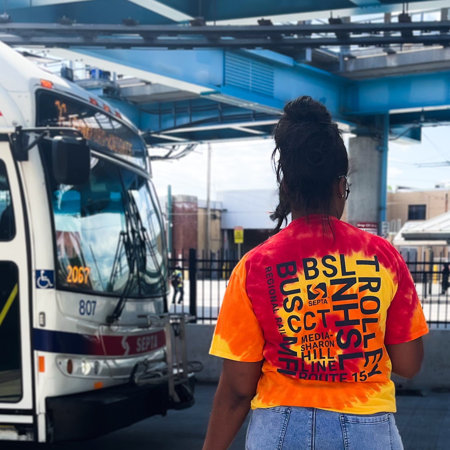 Tie Dye shirt in front of Bus