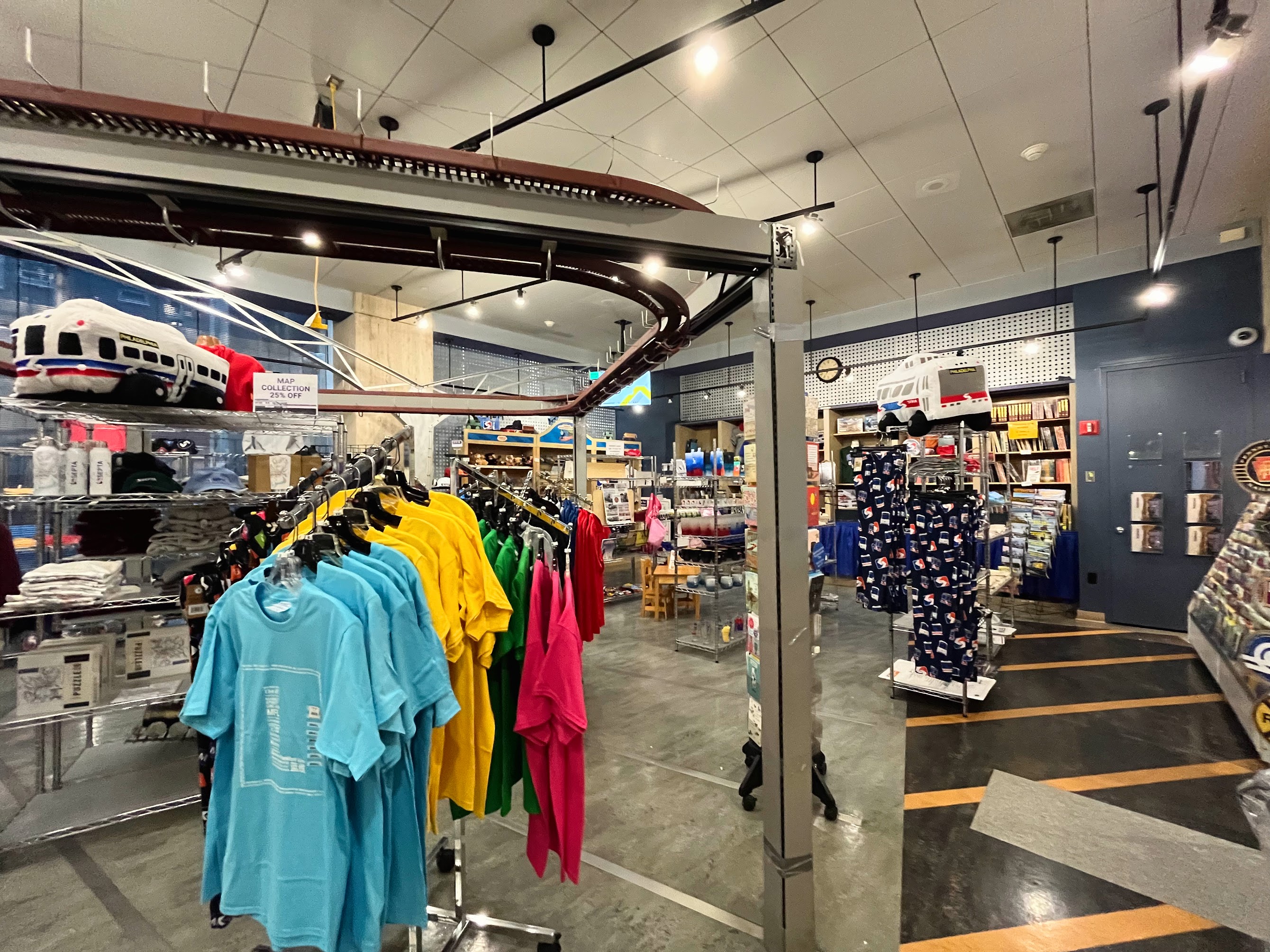 An image of the inside of the SEPTA store surrounded by transit themed merchandise